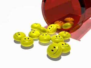 yellow pills with happy faces coming out of red container